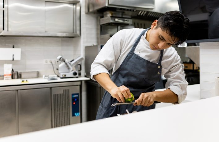 mexican male working in the kitchen
